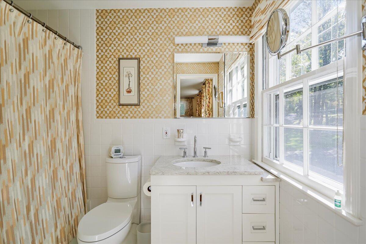 110 Ridge Acres Road Darien, CT 06820 - Photo 19 of 30 a bathroom with a granite countertop toilet sink and mirror