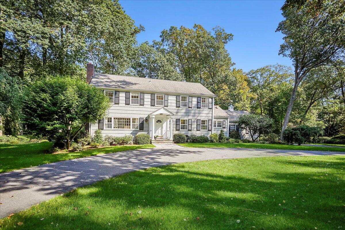 110 Ridge Acres Road Darien, CT 06820 - Photo 2 of 30 a view of a big house with a big yard and large trees