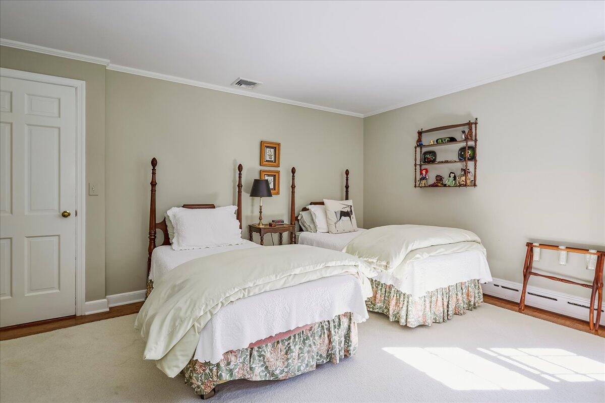 110 Ridge Acres Road Darien, CT 06820 - Photo 21 of 30 a bedroom with two beds and painting on the wall