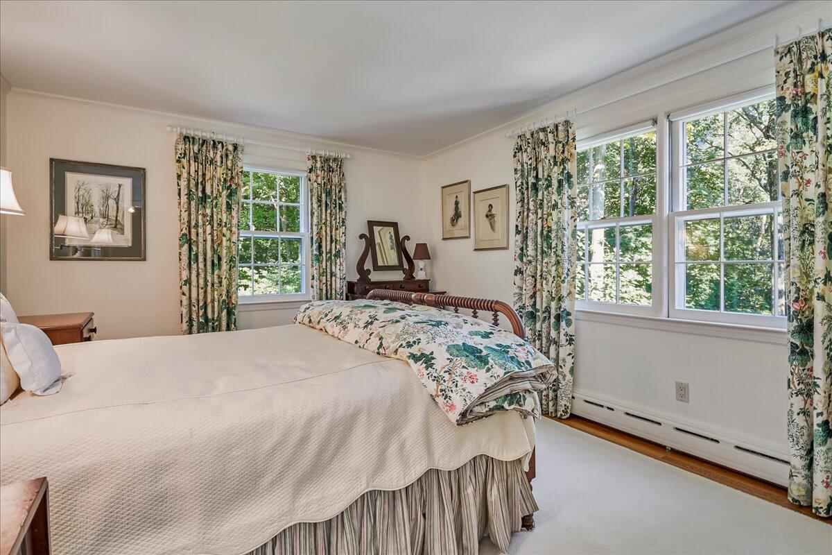 110 Ridge Acres Road Darien, CT 06820 - Photo 23 of 30 a bedroom with a bed and a large window