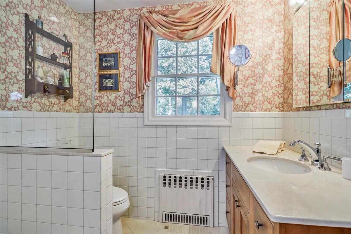 110 Ridge Acres Road Darien, CT 06820 - Photo 24 of 30 a bathroom with a sink and a toilet