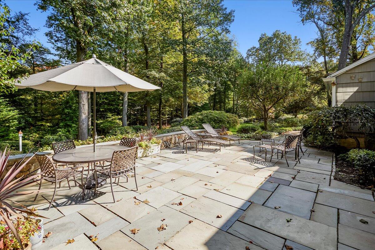 110 Ridge Acres Road Darien, CT 06820 - Photo 25 of 30 a view of backyard of house with seating space