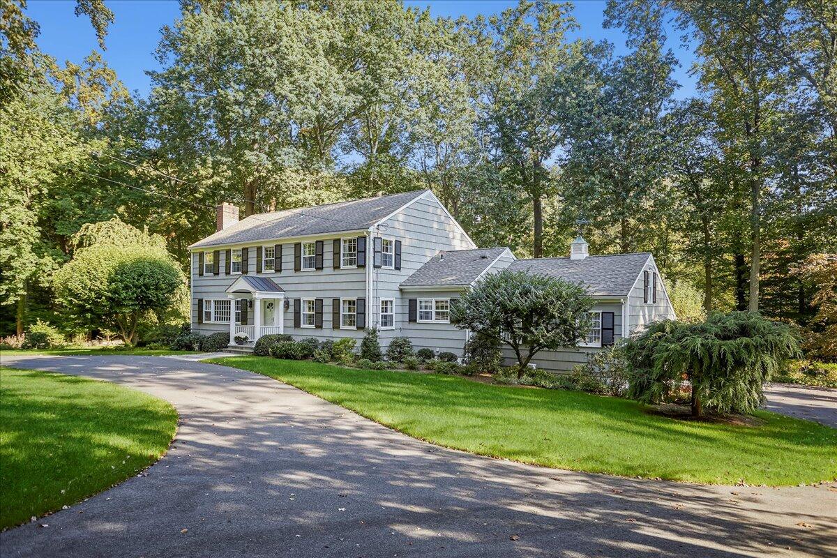 110 Ridge Acres Road Darien, CT 06820 - Photo 3 of 30 a front view of a house with a yard