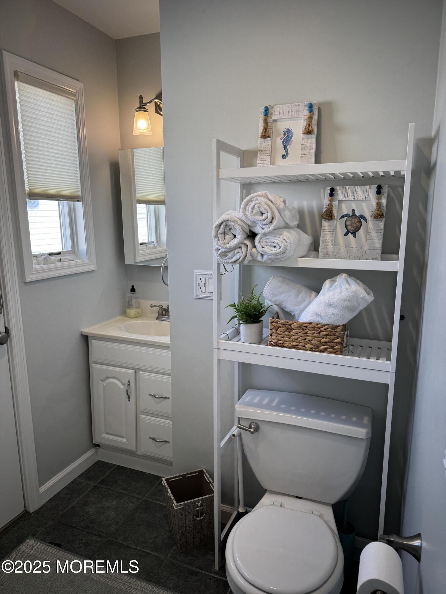 120 West Chadwick Way Lavallette, NJ 08735 - Photo 13 of 13 a bathroom with a toilet a sink and a window