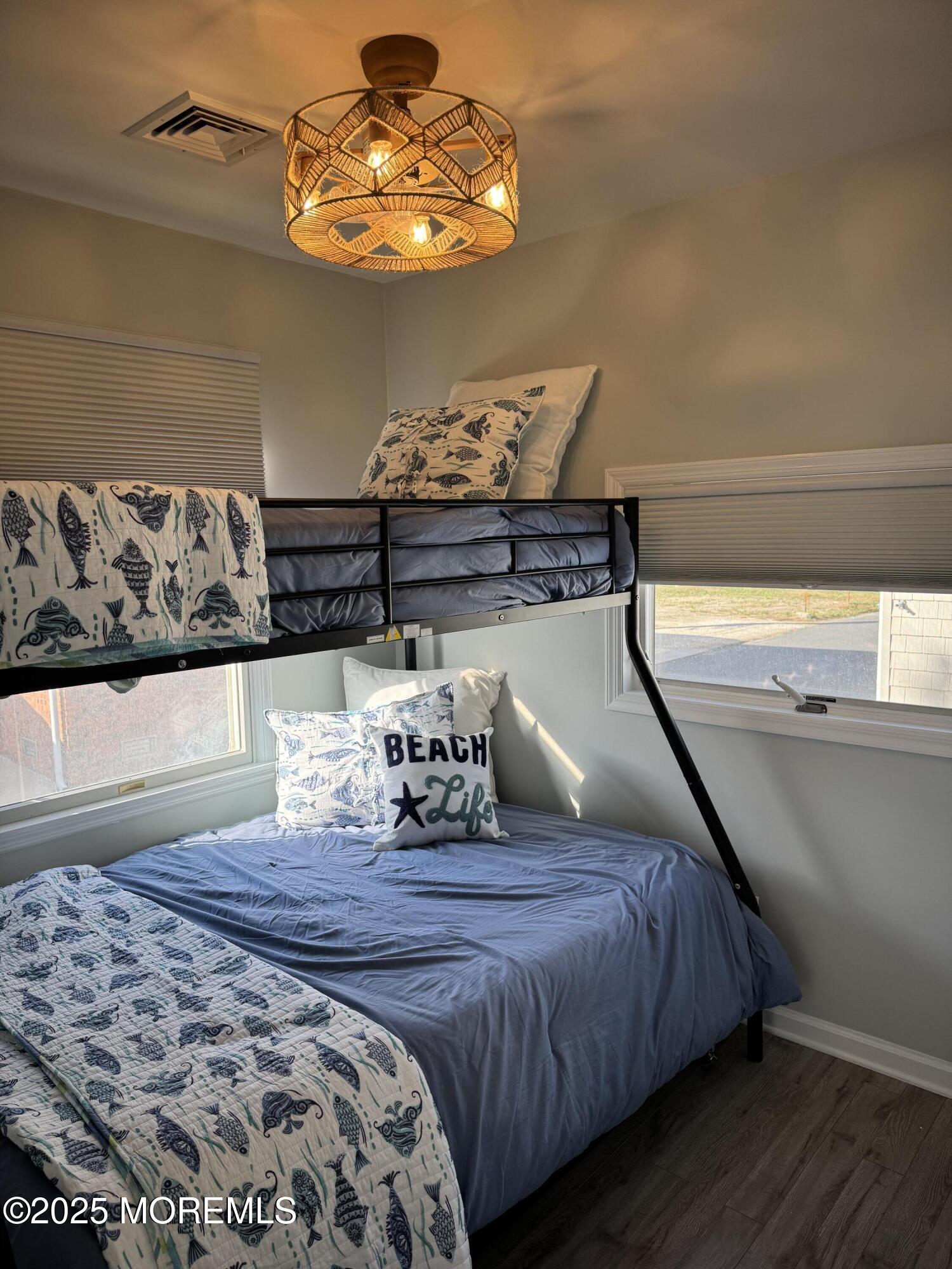 120 West Chadwick Way Lavallette, NJ 08735 - Photo 9 of 13 a bedroom with bed and wooden floor