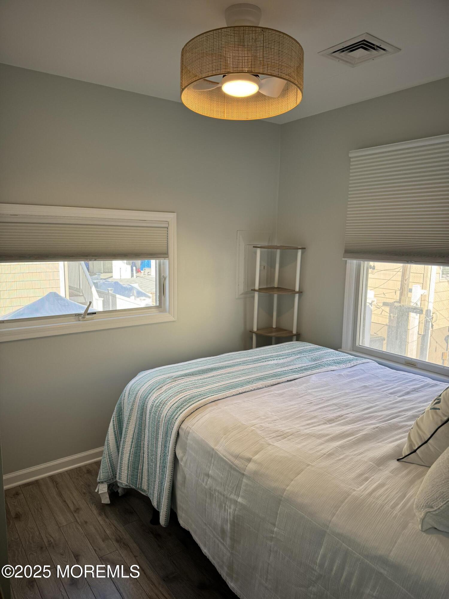 120 West Chadwick Way Lavallette, NJ 08735 - Photo 10 of 13 a bedroom with a bed and a window