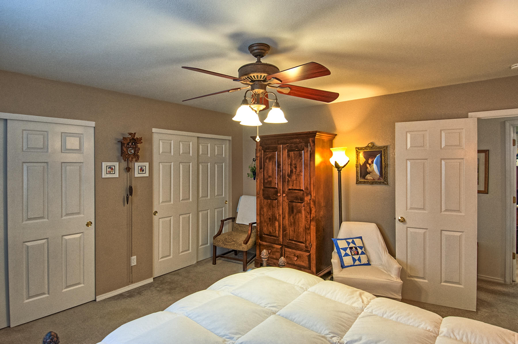 11326 Puffin Way Redding, CA 96003 - Photo 12 of 26 a bedroom with a bed and a chandelier