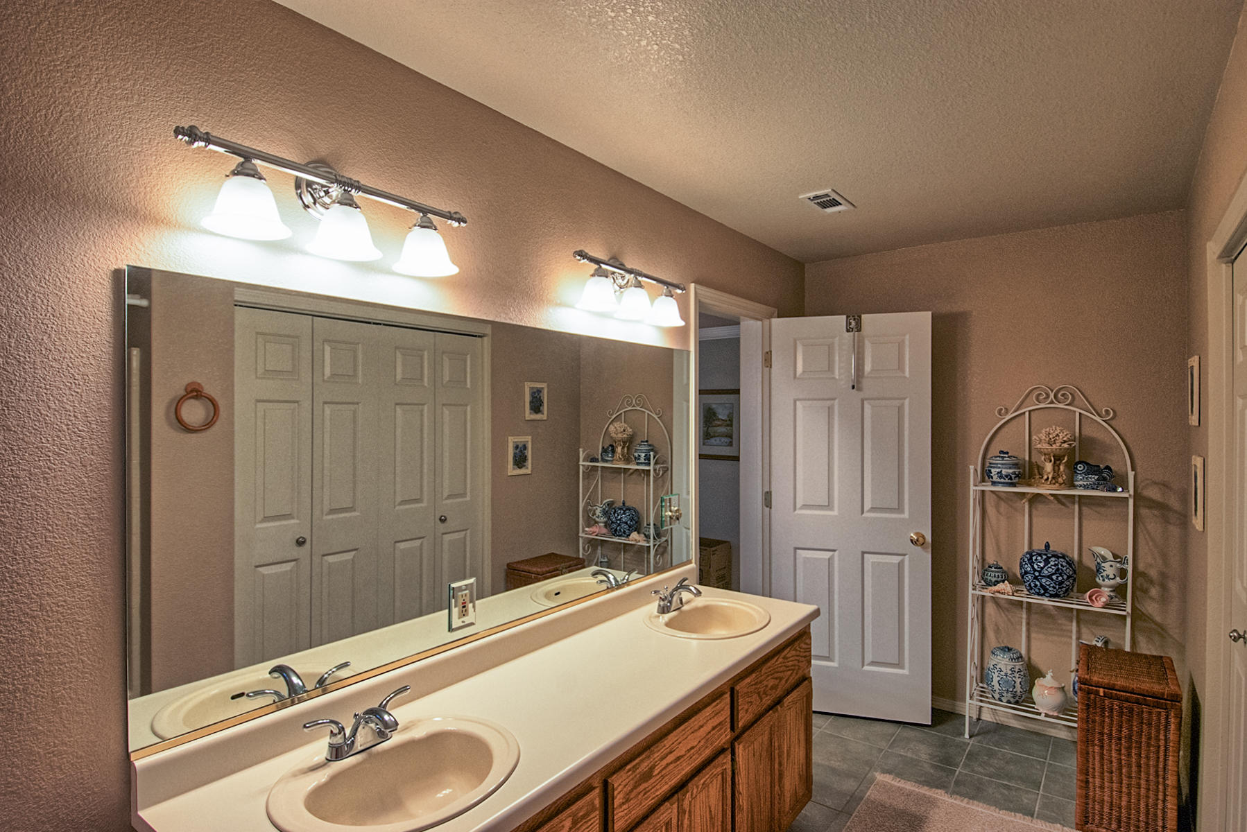11326 Puffin Way Redding, CA 96003 - Photo 13 of 26 a bathroom with a sink double vanity and shower