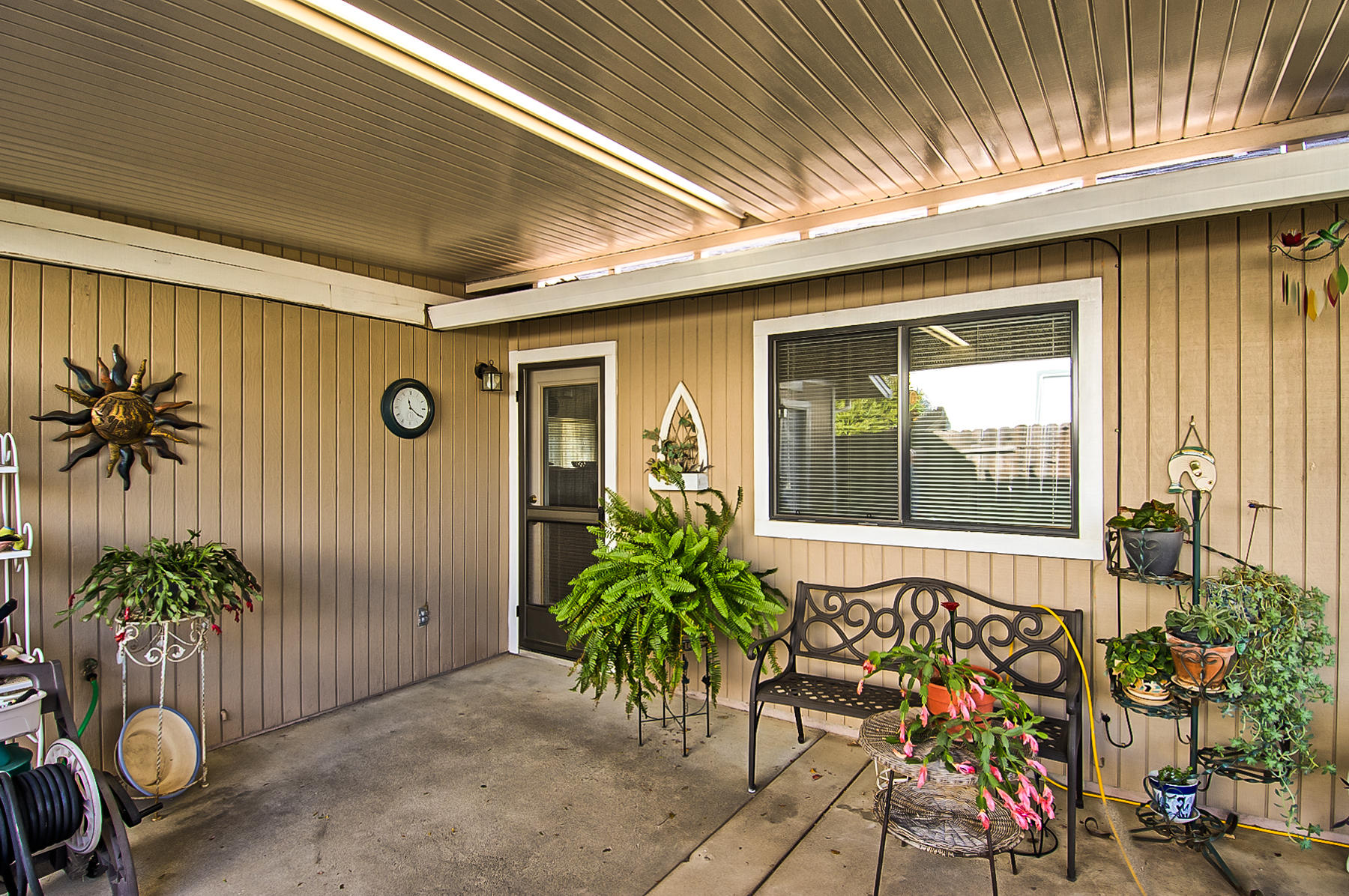 11326 Puffin Way Redding, CA 96003 - Photo 19 of 26 a potted plant sitting in front of a building