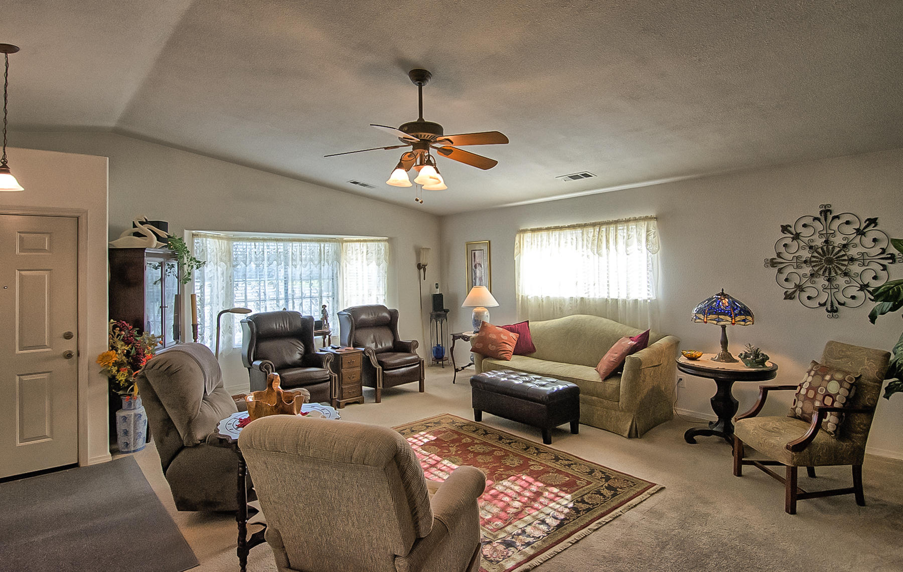 11326 Puffin Way Redding, CA 96003 - Photo 2 of 26 a living room with furniture ceiling fan and a window