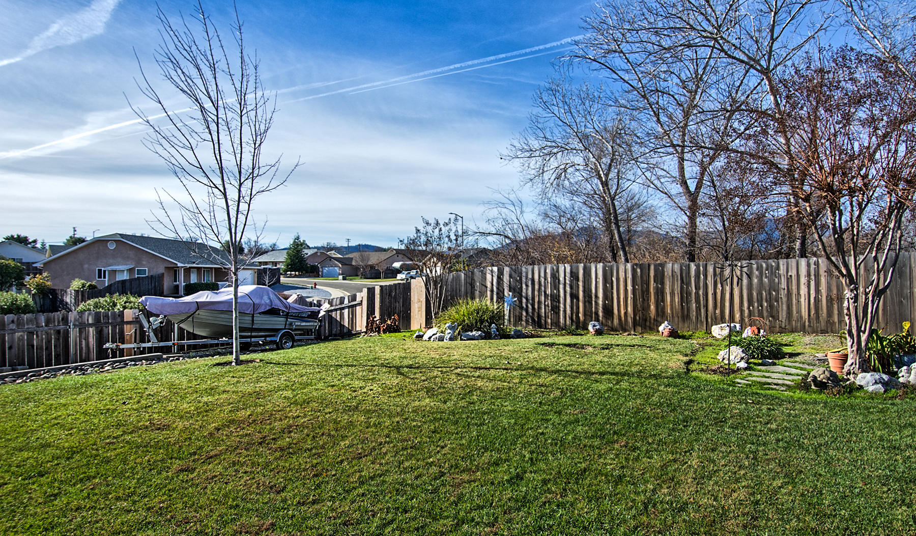 11326 Puffin Way Redding, CA 96003 - Photo 23 of 26 a green field covered with tall trees