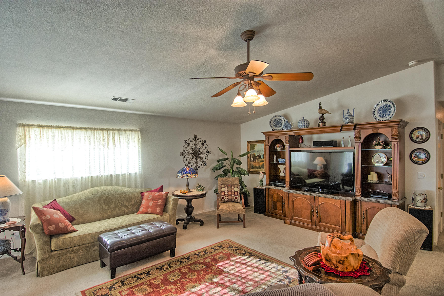11326 Puffin Way Redding, CA 96003 - Photo 3 of 26 a living room with furniture and a flat screen tv