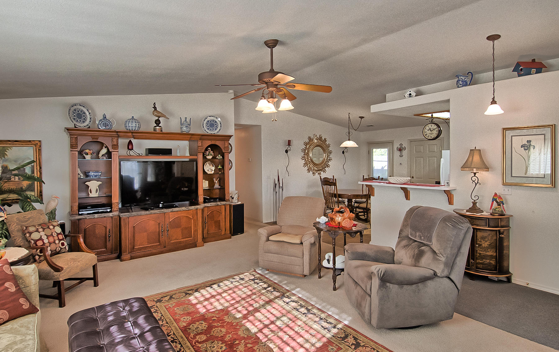 11326 Puffin Way Redding, CA 96003 - Photo 4 of 26 a living room with furniture and a flat screen tv