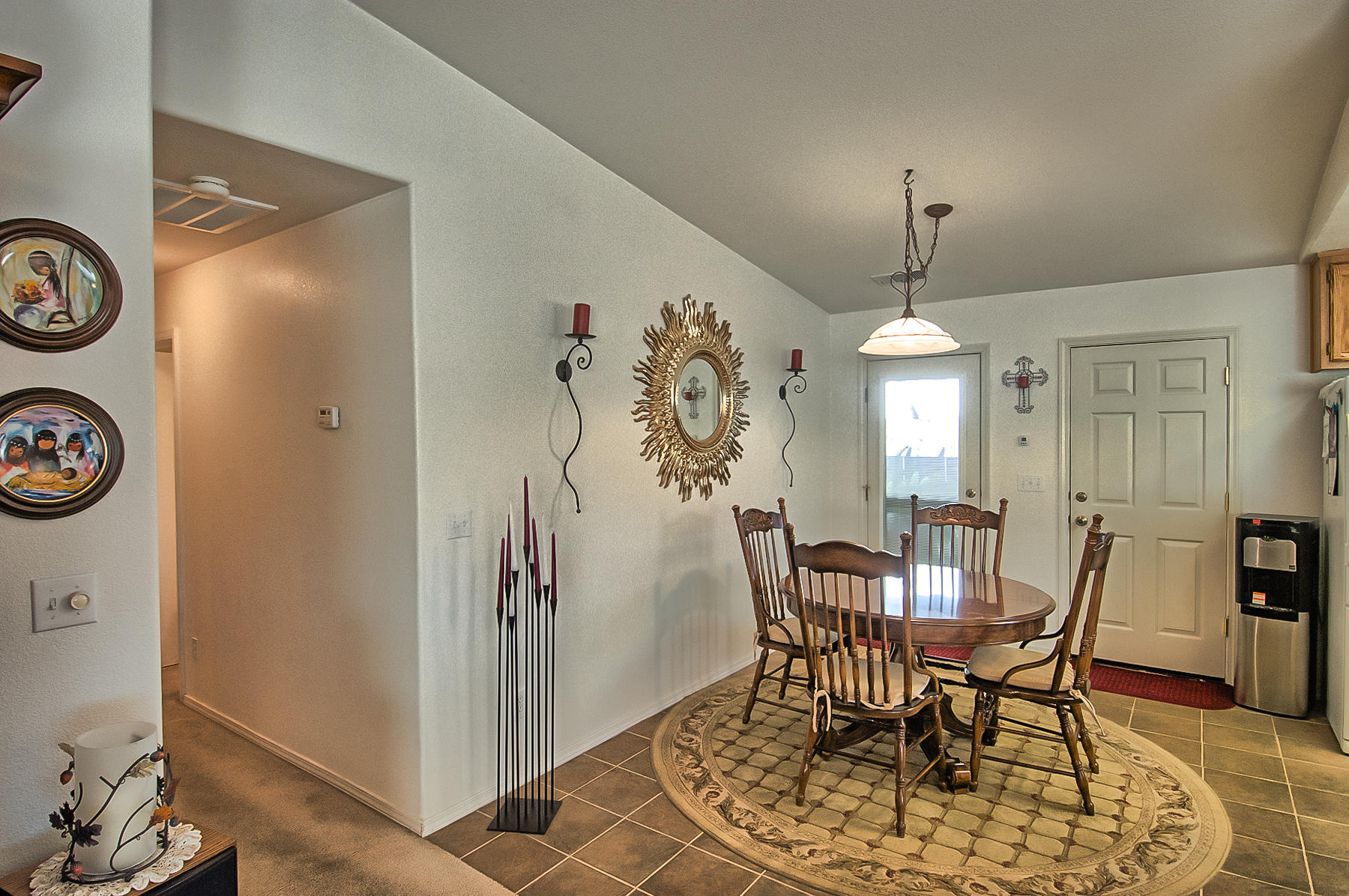 11326 Puffin Way Redding, CA 96003 - Photo 5 of 26 a view of a dining room with furniture and wooden floor