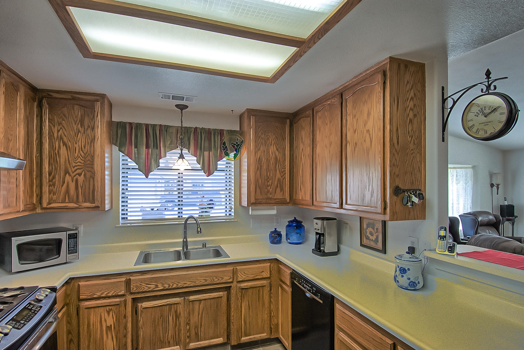 11326 Puffin Way Redding, CA 96003 - Photo 9 of 26 a kitchen with a sink cabinets and window