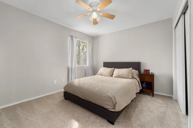 a bedroom with a bed and window
