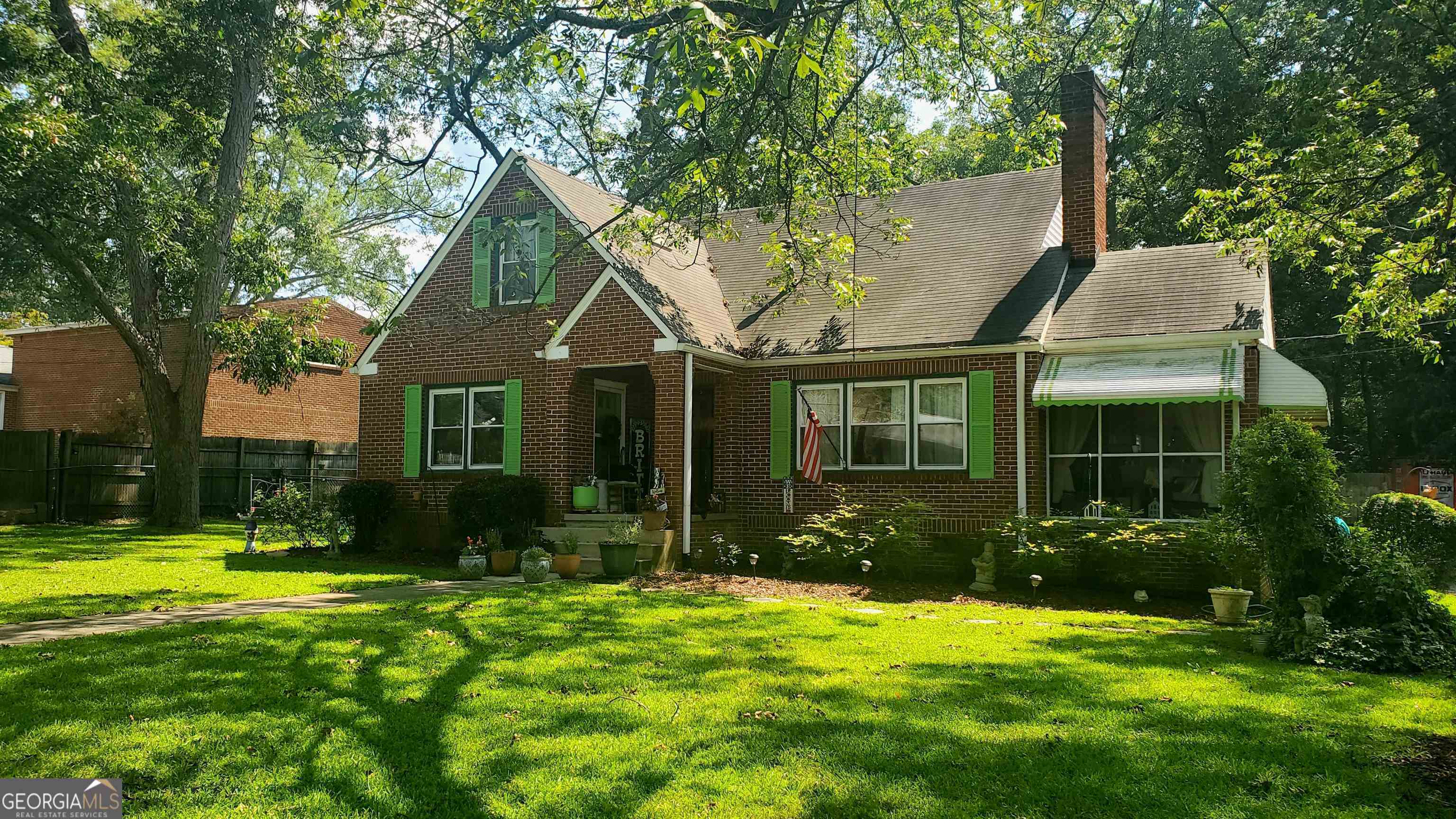 111 Spring Street Jonesboro, GA 30236 - Photo 1 of 1 a view of a house with a yard and plants