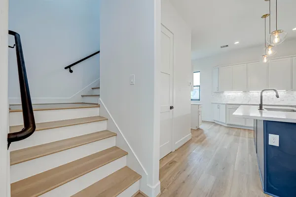 a view of a kitchen from the hallway