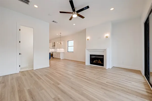 a view of a room window and wooden floor
