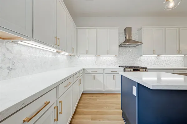 a kitchen with a sink dishwasher a stove and a refrigerator