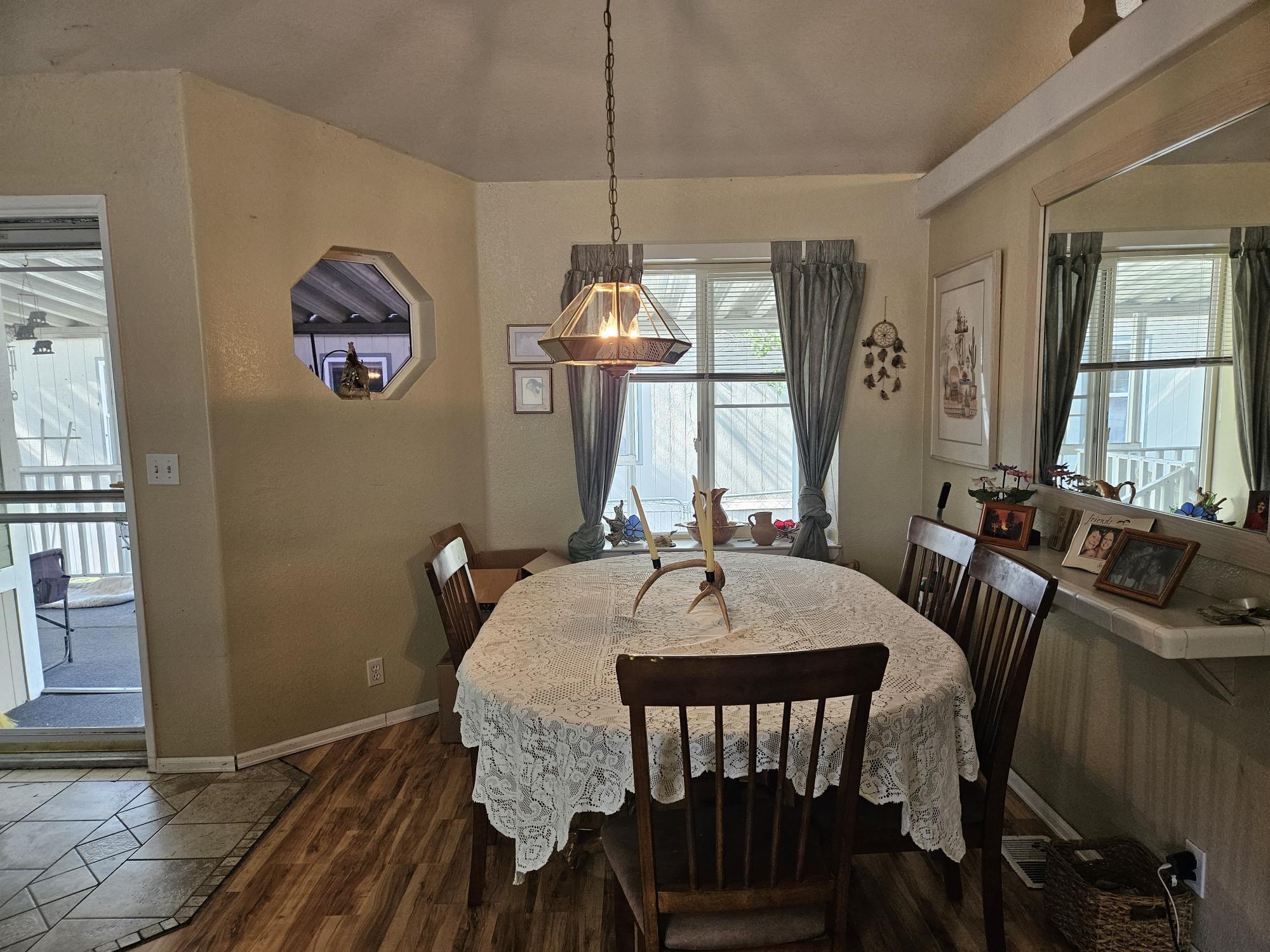 435 32 Road, Unit 424 Clifton, CO 81520 - Photo 9 of 21 a view of a a dining room with furniture window and wooden floor