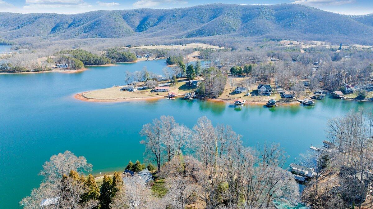 188 Hardy Court Penhook, VA 24137 - Photo 114 of 114 a view of a lake with lawn chairs