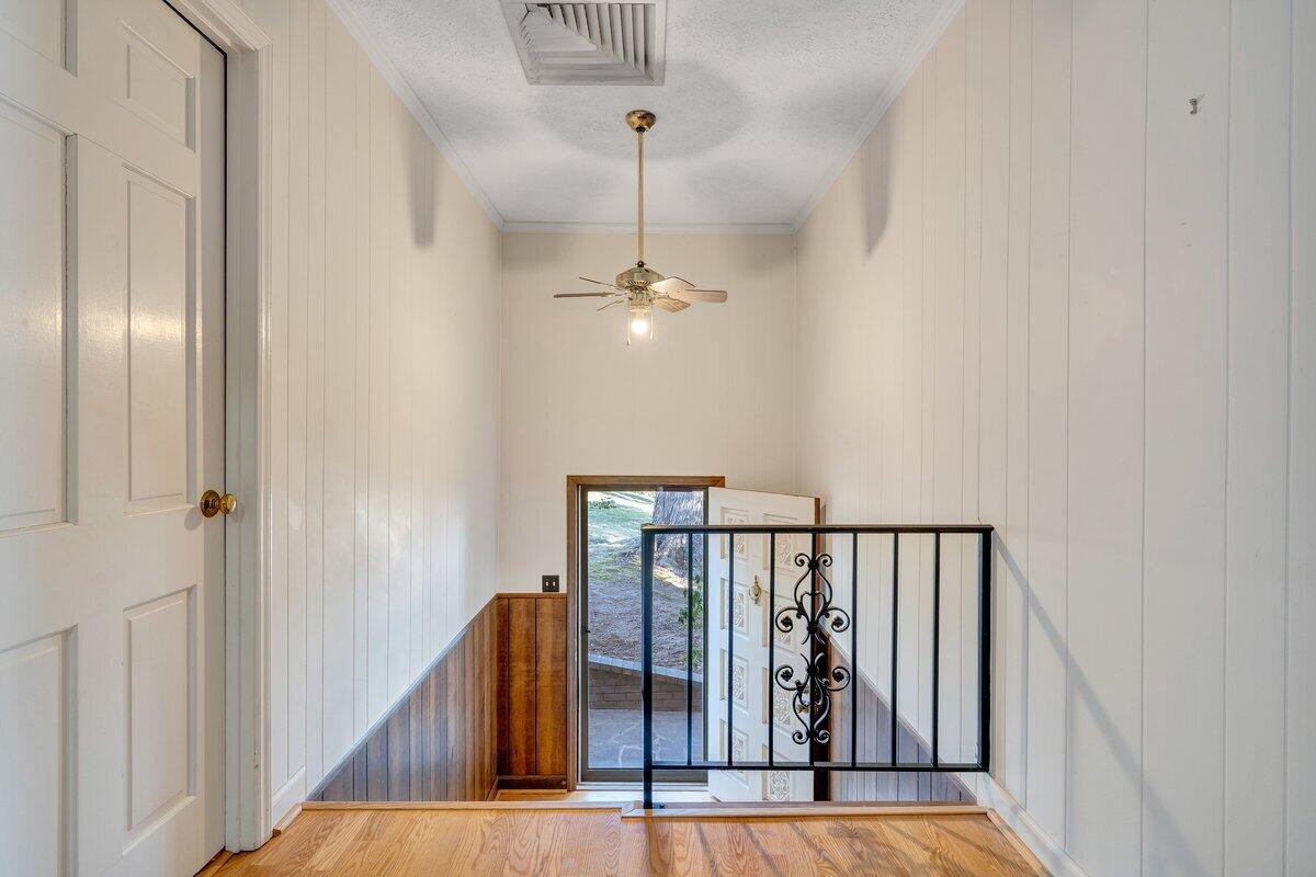 188 Hardy Court Penhook, VA 24137 - Photo 31 of 114 a view of a hallway with wooden floor and staircase