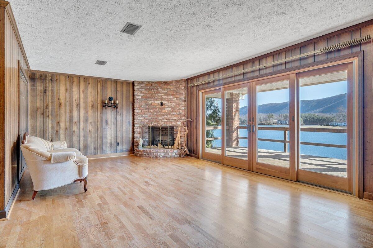 188 Hardy Court Penhook, VA 24137 - Photo 32 of 114 a view of an empty room with wooden floor and a window