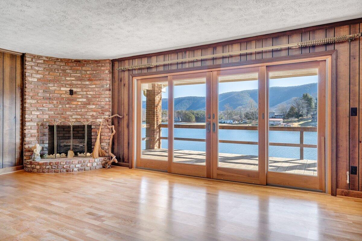 188 Hardy Court Penhook, VA 24137 - Photo 37 of 114 a view of an empty room with wooden floor and a window