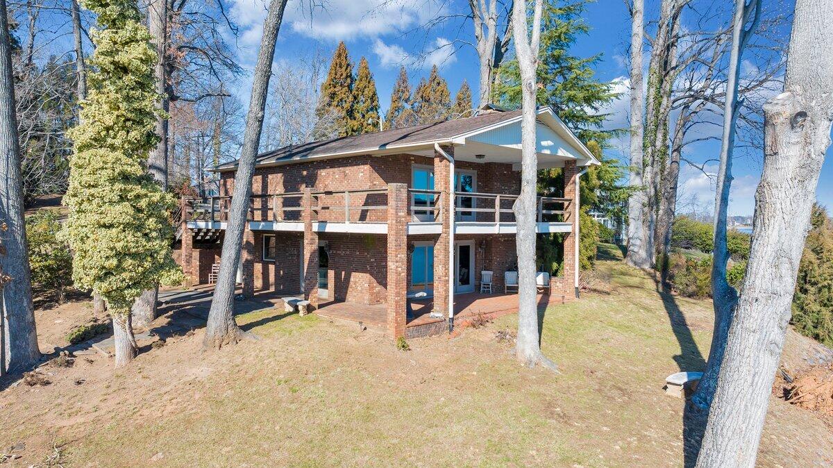 188 Hardy Court Penhook, VA 24137 - Photo 4 of 114 a view of a house with a yard and sitting area