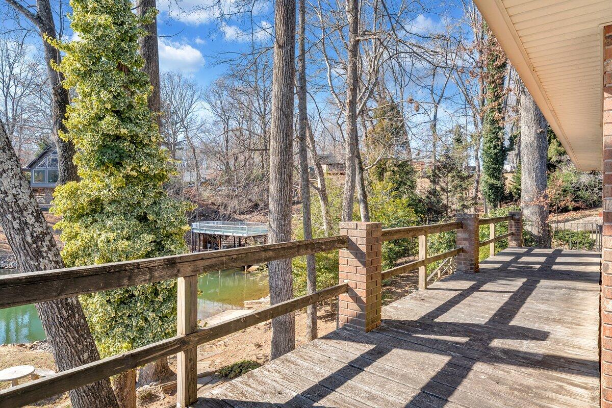 188 Hardy Court Penhook, VA 24137 - Photo 53 of 114 a view of a balcony with wooden floor and fence
