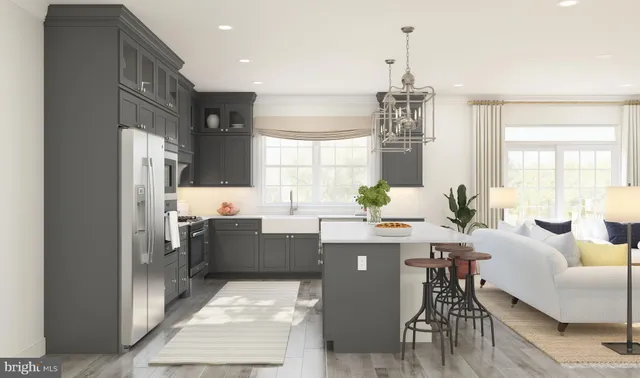 a room with kitchen island granite countertop furniture and a chandelier