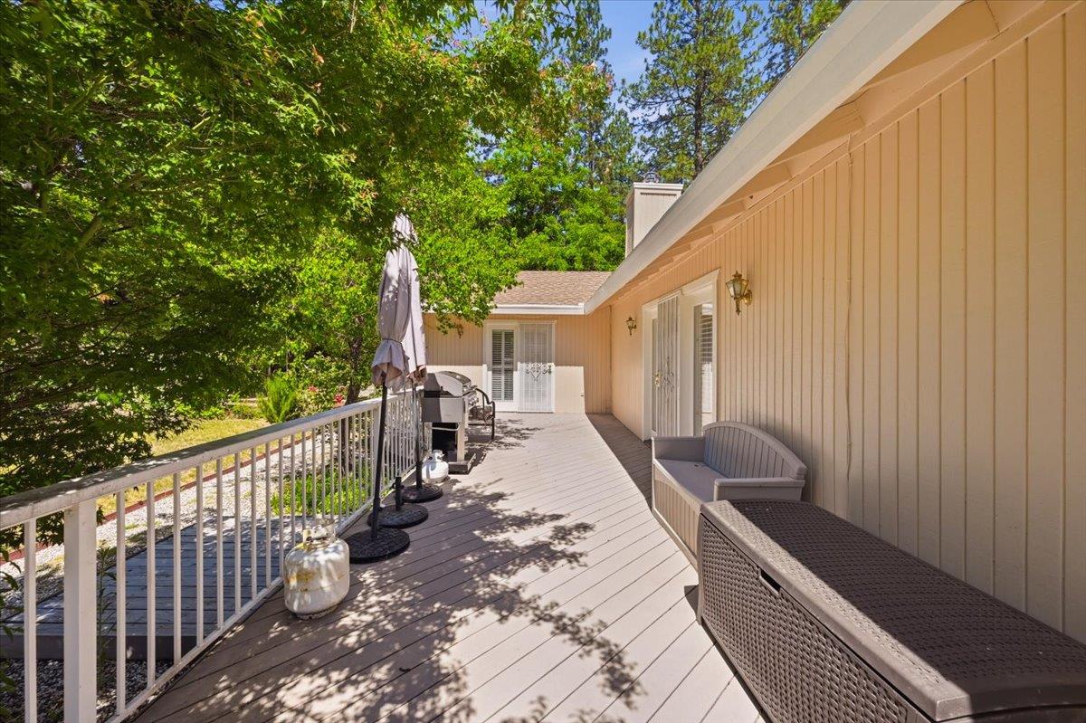 12600 Friar Tuck Road Grass Valley, CA 95949 - Photo 34 of 56 a view of a chair and tables in the balcony