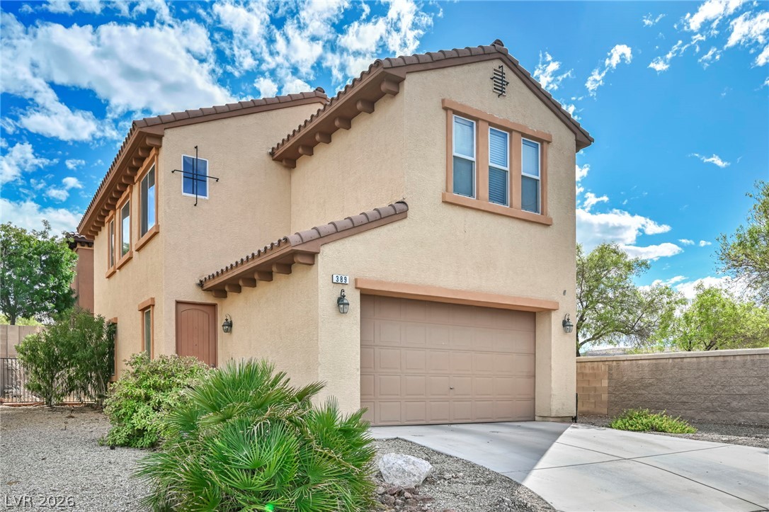 389 Fringe Ruff Drive Las Vegas, NV 89148 - Photo 1 of 53 Stucco exterior and Spanish tile rooflines define this multi-level residential design.