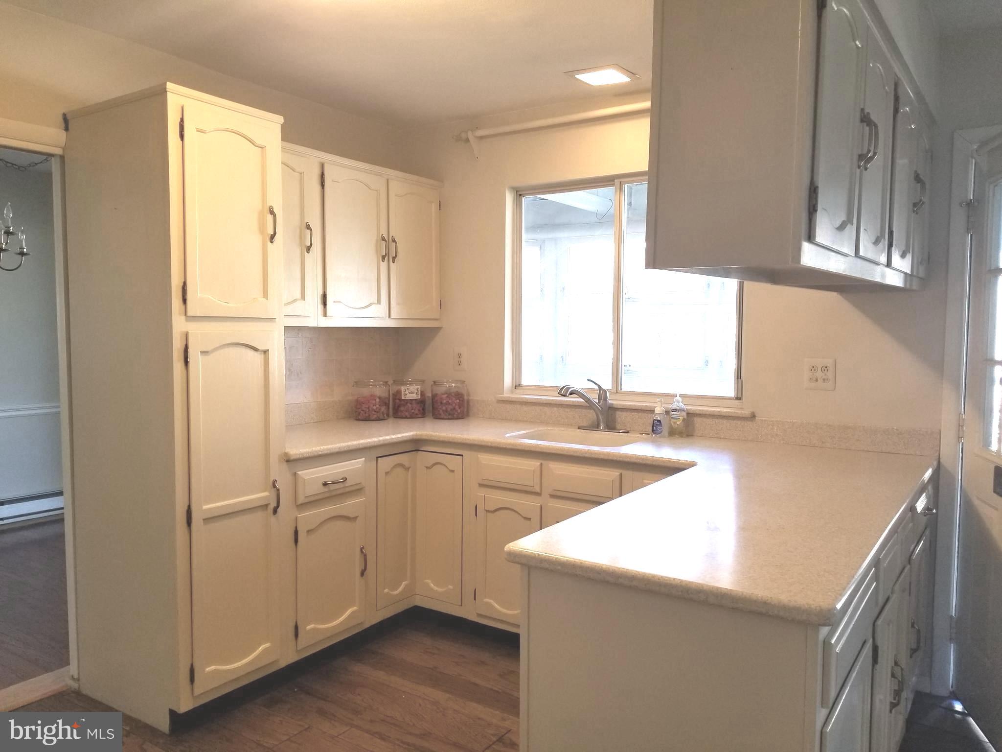 26 Dunstable Road Southampton, NJ 08088 - Photo 11 of 31 a kitchen with a sink stove and cabinets
