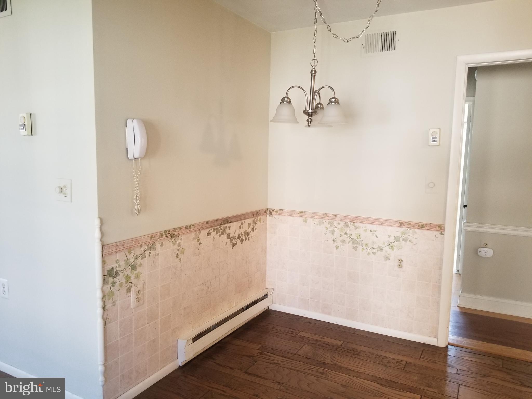 26 Dunstable Road Southampton, NJ 08088 - Photo 13 of 31 a view of a room with wooden floor and white walls