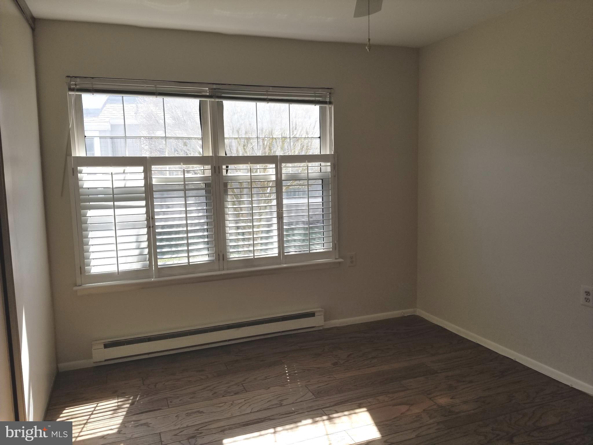 26 Dunstable Road Southampton, NJ 08088 - Photo 20 of 31 an empty room with wooden floor and windows