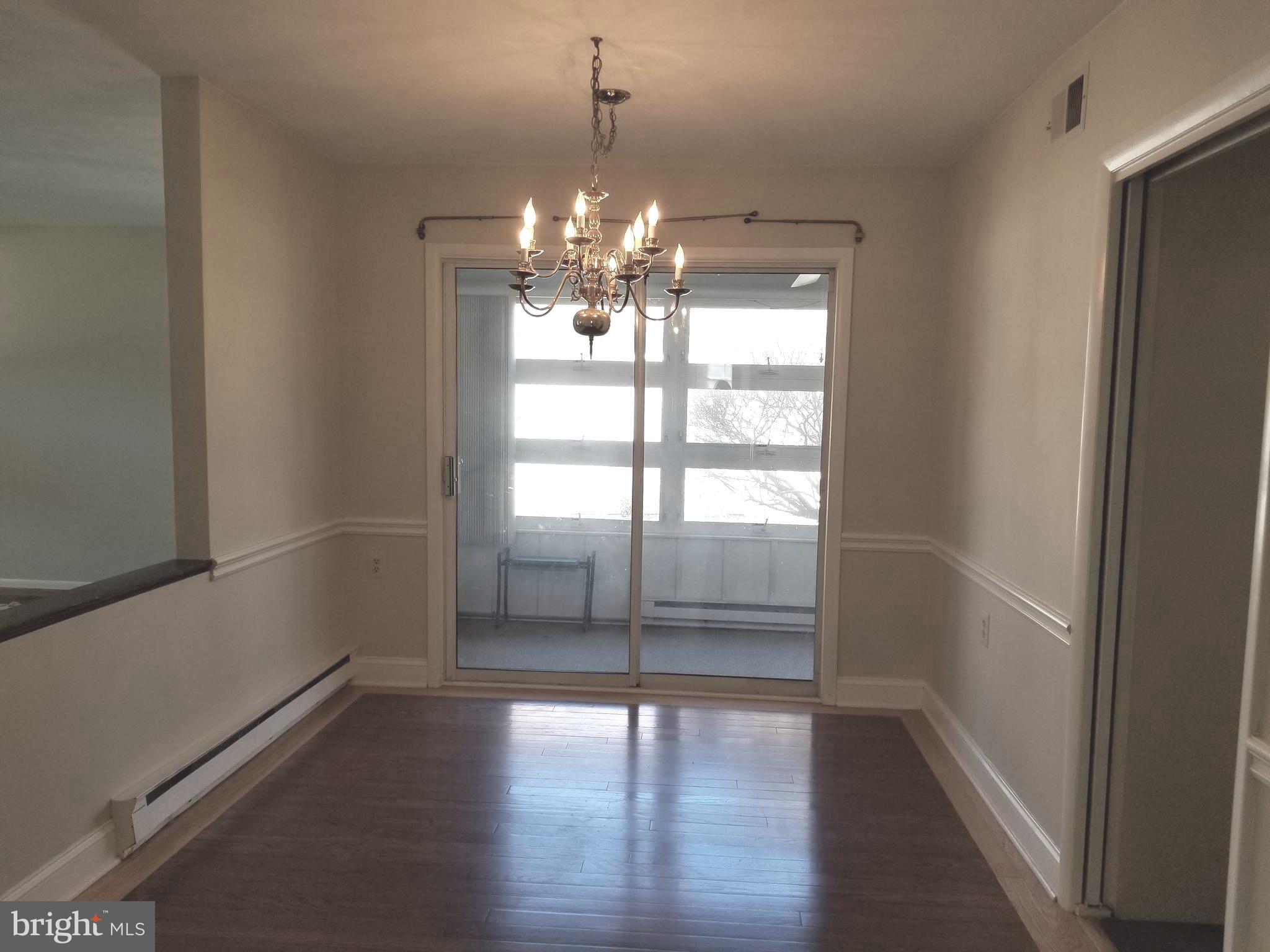 26 Dunstable Road Southampton, NJ 08088 - Photo 8 of 31 a view of a room with wooden floor and chandelier