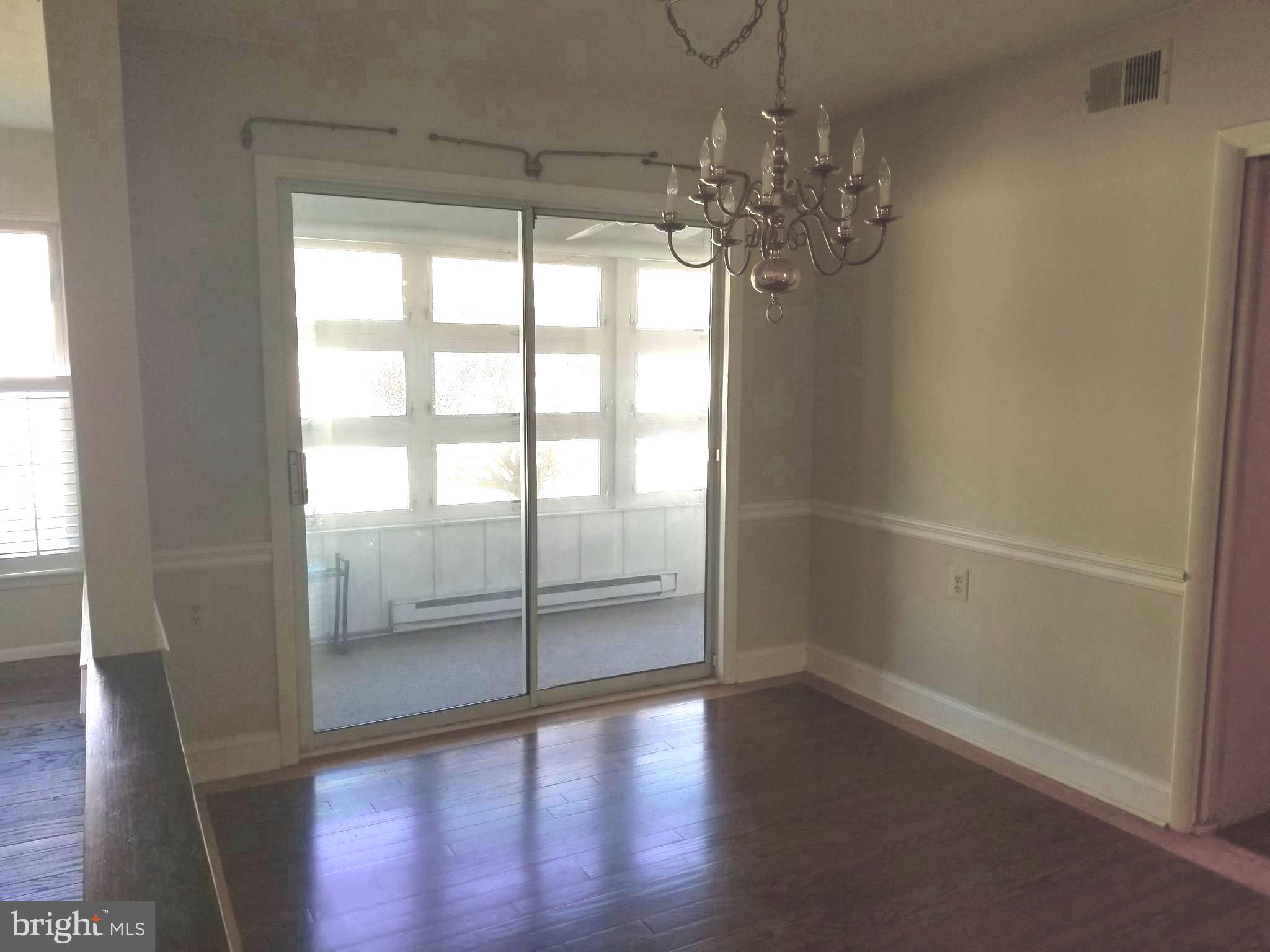 26 Dunstable Road Southampton, NJ 08088 - Photo 9 of 31 wooden floor in an empty room with a window