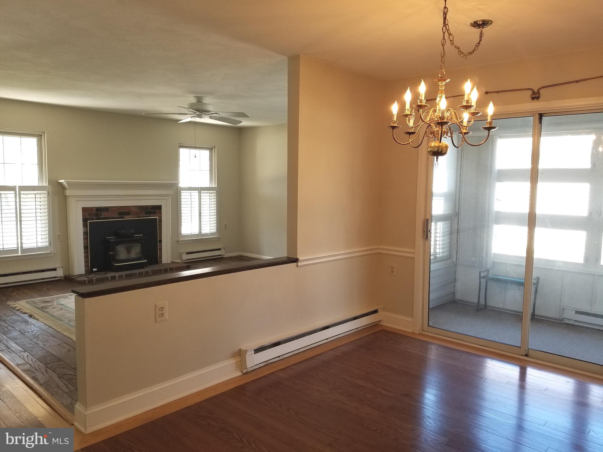 26 Dunstable Road Southampton, NJ 08088 - Photo 10 of 31 a view of a room with wooden floor and fireplace