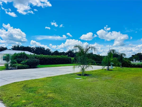 a view of a golf course with a lake
