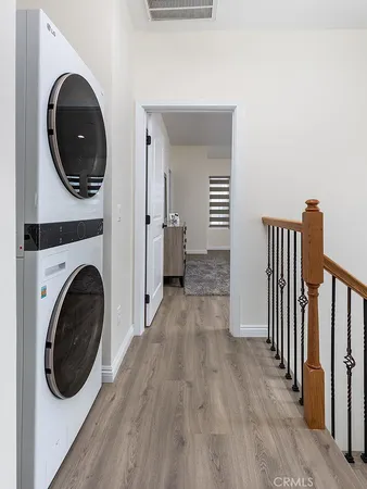 a view of a hallway with washer and dryer