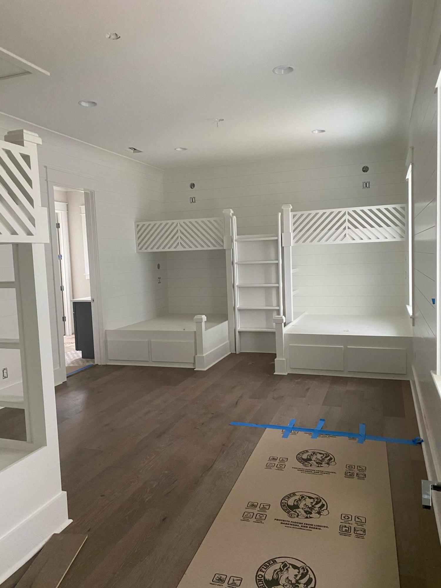 60 Walton Gulfview Drive Inlet Beach, FL 32461 - Photo 4 of 8 a view of a hallway to room with wooden floor