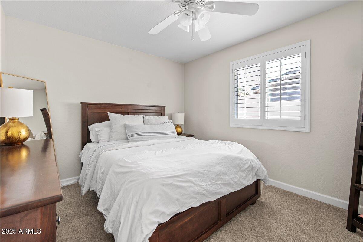6520 East Osborn Road Scottsdale, AZ 85251 - Photo 12 of 21 a bedroom with a bed and a window