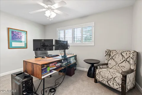 a room with chandelier furniture and a window
