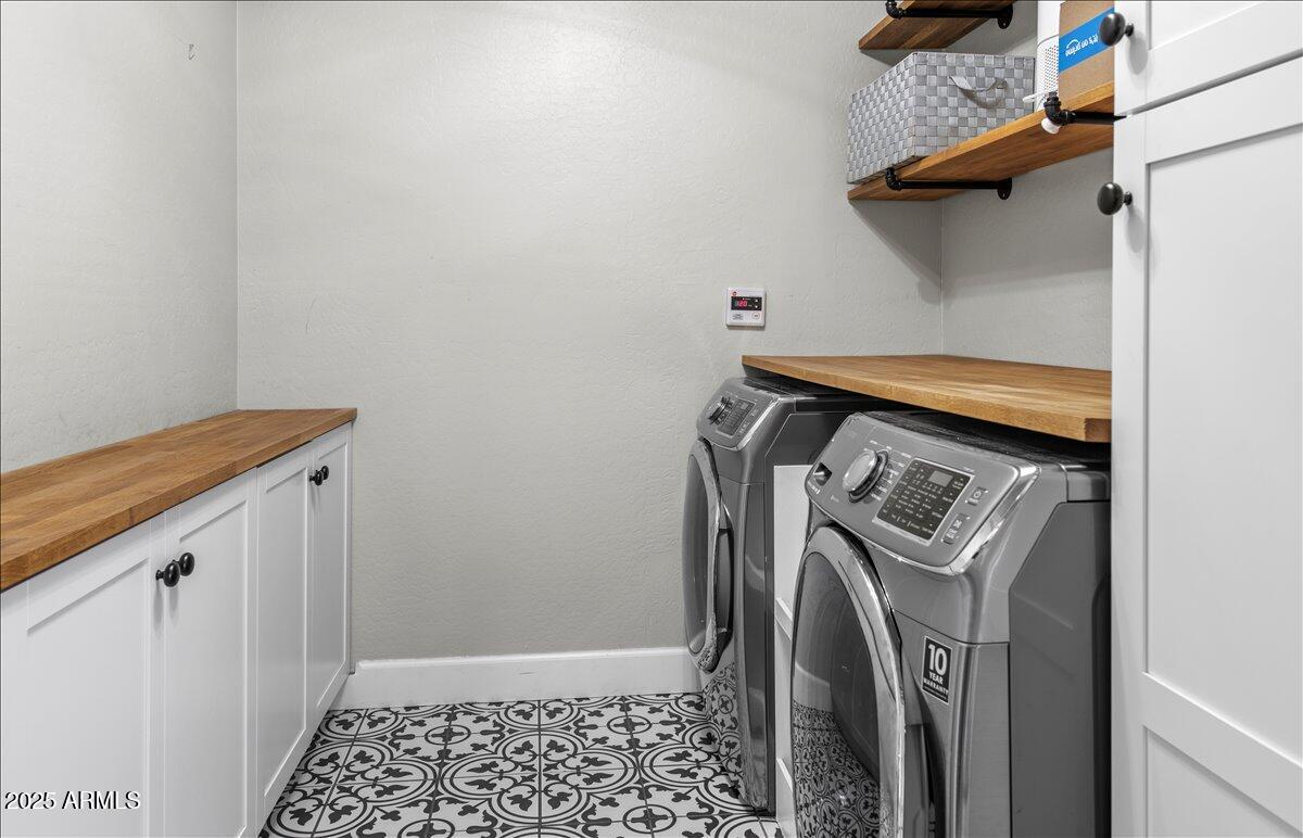 6520 East Osborn Road Scottsdale, AZ 85251 - Photo 16 of 21 a utility room with dryer and washer