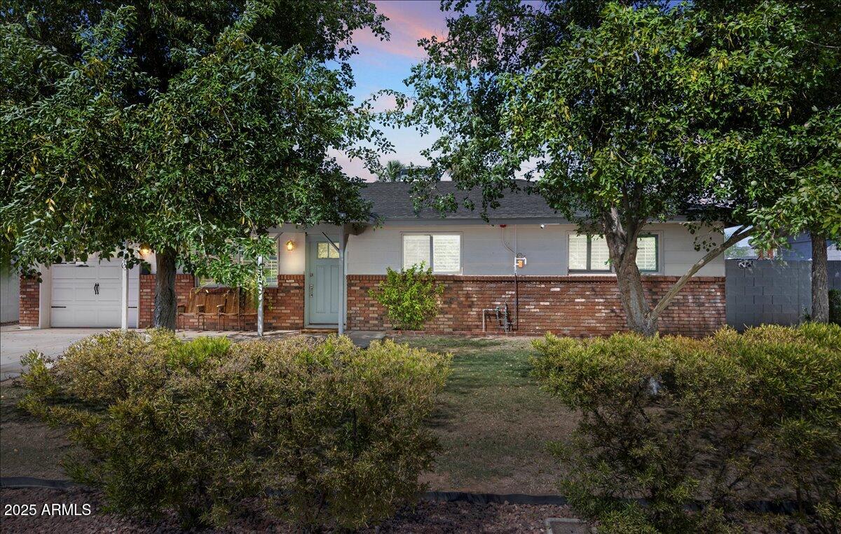 6520 East Osborn Road Scottsdale, AZ 85251 - Photo 20 of 21 a front view of a house with a yard