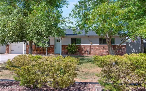 front view of a house with a small yard