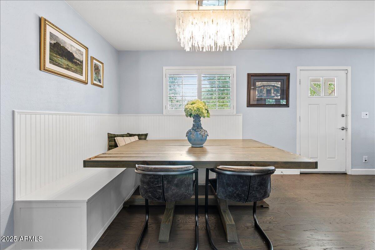 6520 East Osborn Road Scottsdale, AZ 85251 - Photo 9 of 21 a view of a dining room with furniture and chandelier