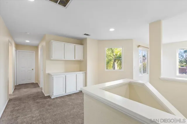 a view of a kitchen with a sink cabinets and a window